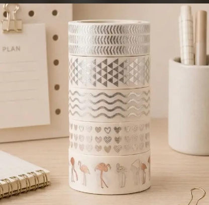 Miso station decorative washi tape set with silver foil patterns including hearts, waves, and flamingos on a desk.