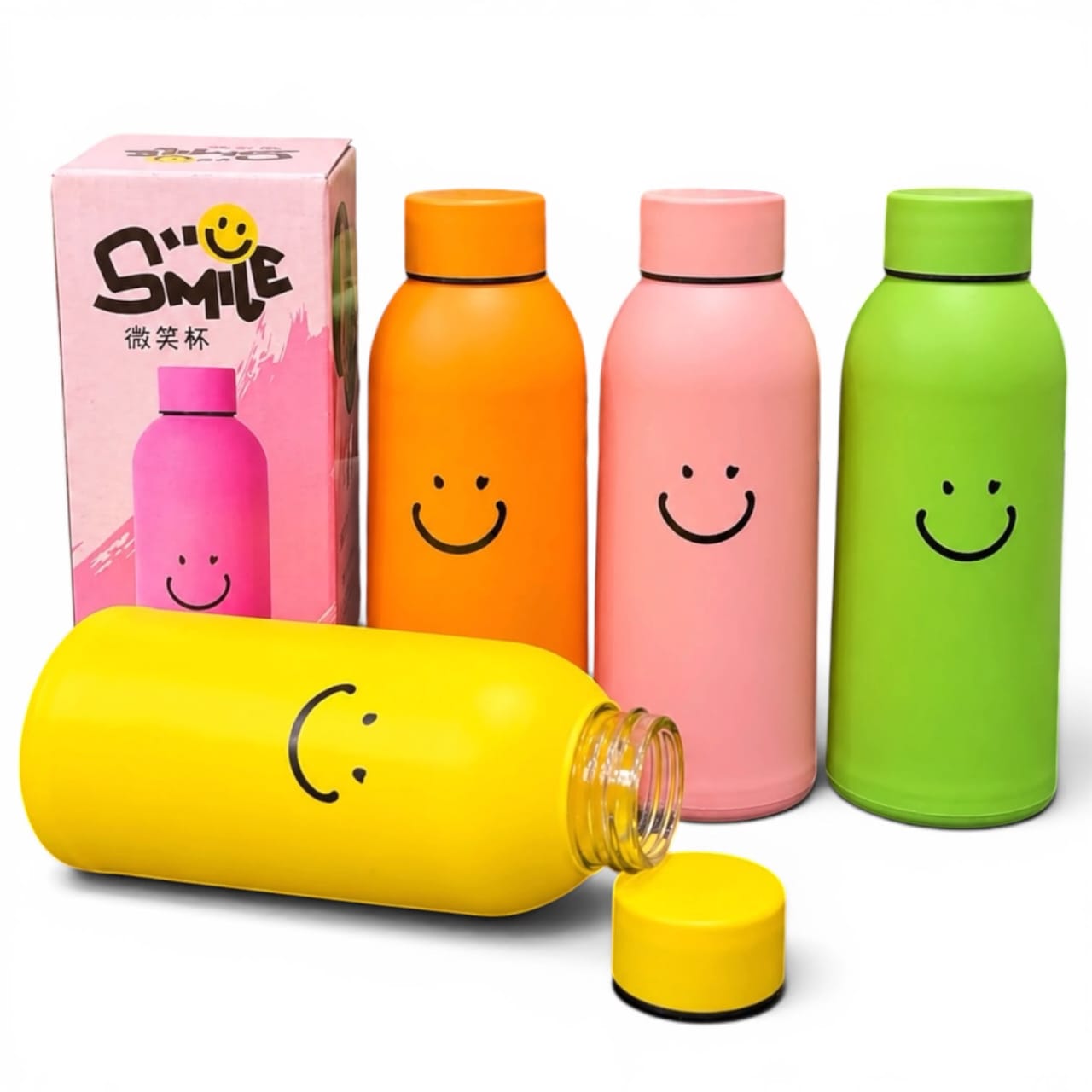 Miso station matte insulated water bottles in yellow, orange, pink, and green with a smiley face design and box.