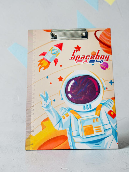 Miso station space-themed clipboard featuring an astronaut, rocket, and integrated ruler on a white textured background