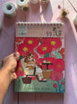 Miso station 16K spiral-bound sketchbook with a whimsical illustration of a girl relaxing among large red flowers.