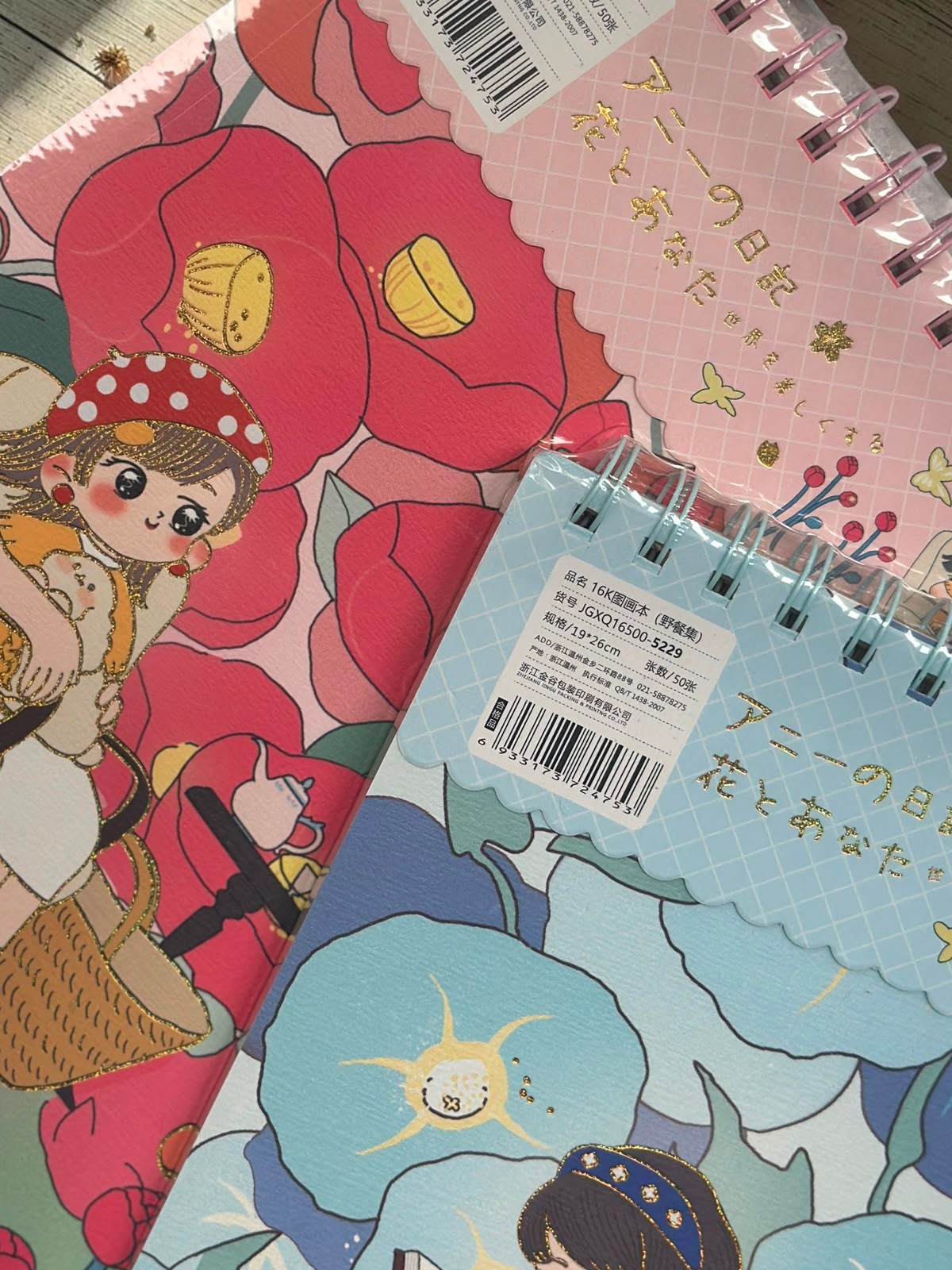 Miso station 16K spiral-bound sketchbooks with whimsical character illustrations and floral patterns in pink and blue