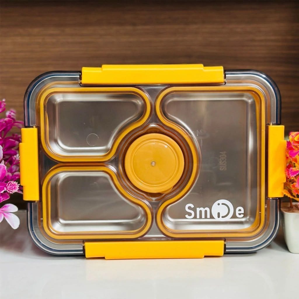 Miso station stainless steel bento lunch box with yellow locking clips and a transparent leak-resistant lid.