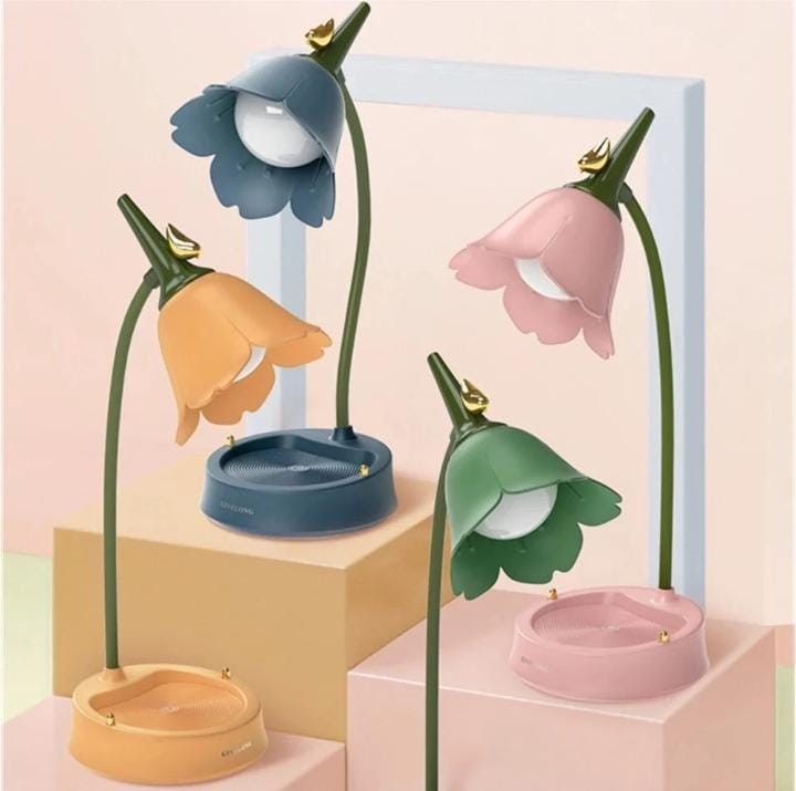 Miso station tulip-shaped desk lamps in blue, pink, orange, and green with flexible necks and storage bases.