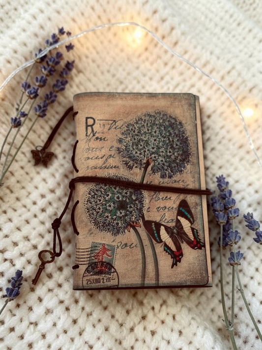 Miso station vintage-style journal with botanical and butterfly cover art, cord closure, and metal key and charm