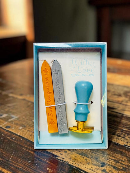 Miso station wax seal kit with a light blue handle stamp, gold and silver wax sticks in a gift box.