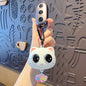 Miso station white silicone cartoon cat keychain with large expressive eyes and a colorful kitty charm
