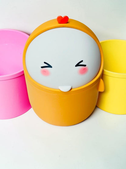 Miso station yellow desktop waste bin with a cute character face, swing-top lid, and small red heart detail.