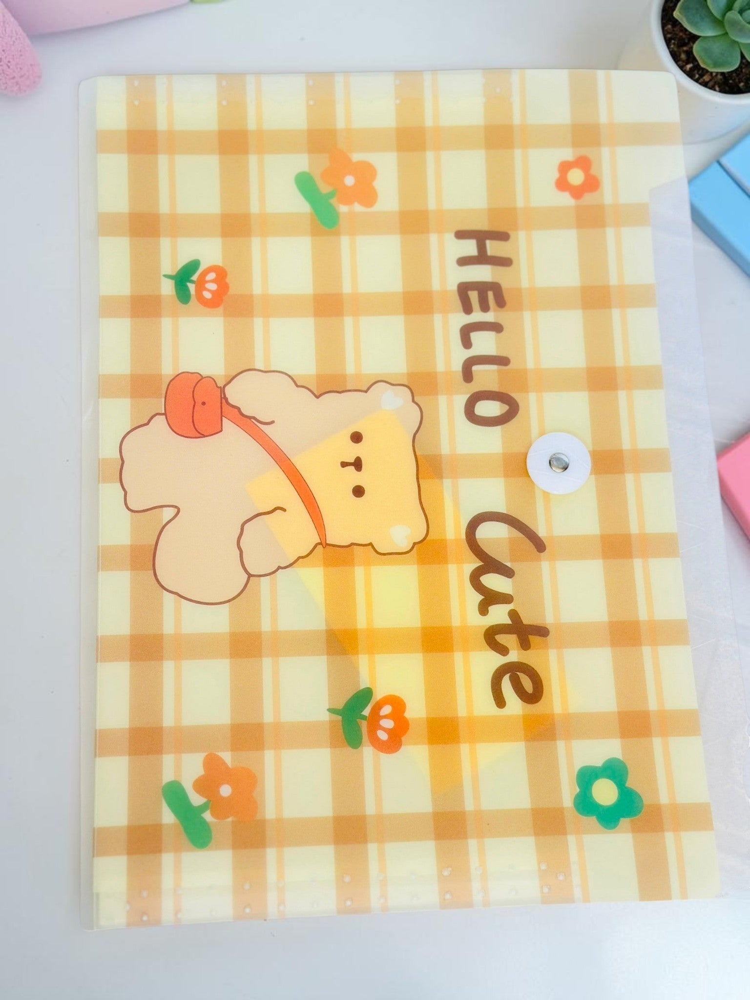 Miso station A4 document folder in frosted plastic with a yellow plaid pattern, bear character, and snap closure.